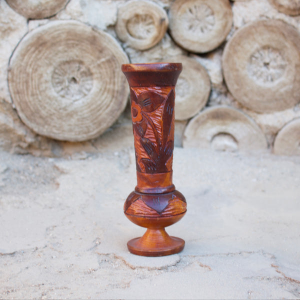 1970s Hand-carved wooden vessel, perfect for a tropical vintage feel in any room.  Measures 8.5" tall x 2.5" diameter  Features a Tiki Hut and flower  Spot clean only  *Note that due to the vintage status of wear - while we clean as thoroughly as we can, there may be some sun stains still existing.  Please examine the photos closely before making your purchase.  If you would like more information or have any other specific questions regarding the condition - email found@thehiddenhome.store*