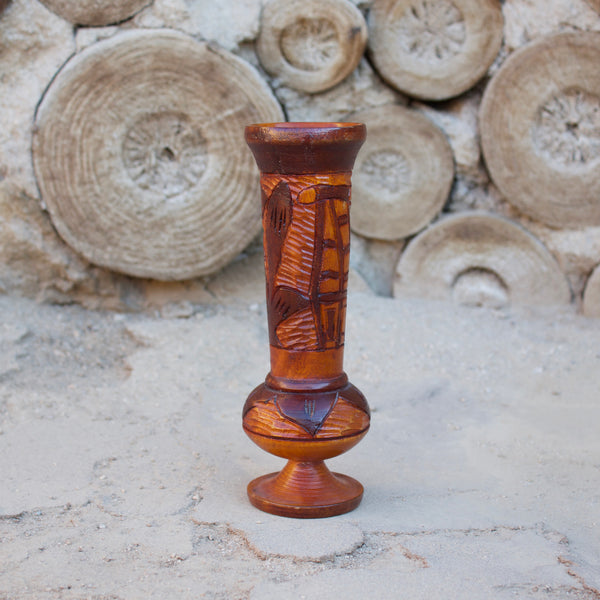 1970s Hand-carved wooden vessel, perfect for a tropical vintage feel in any room.  Measures 8.5" tall x 2.5" diameter  Features a Tiki Hut and flower  Spot clean only  *Note that due to the vintage status of wear - while we clean as thoroughly as we can, there may be some sun stains still existing.  Please examine the photos closely before making your purchase.  If you would like more information or have any other specific questions regarding the condition - email found@thehiddenhome.store*