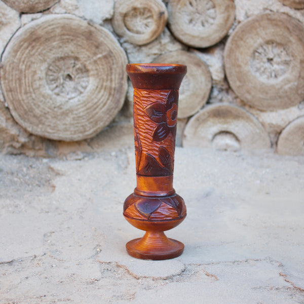 1970s Hand-carved wooden vessel, perfect for a tropical vintage feel in any room.  Measures 8.5" tall x 2.5" diameter  Features a Tiki Hut and flower  Spot clean only  *Note that due to the vintage status of wear - while we clean as thoroughly as we can, there may be some sun stains still existing.  Please examine the photos closely before making your purchase.  If you would like more information or have any other specific questions regarding the condition - email found@thehiddenhome.store*