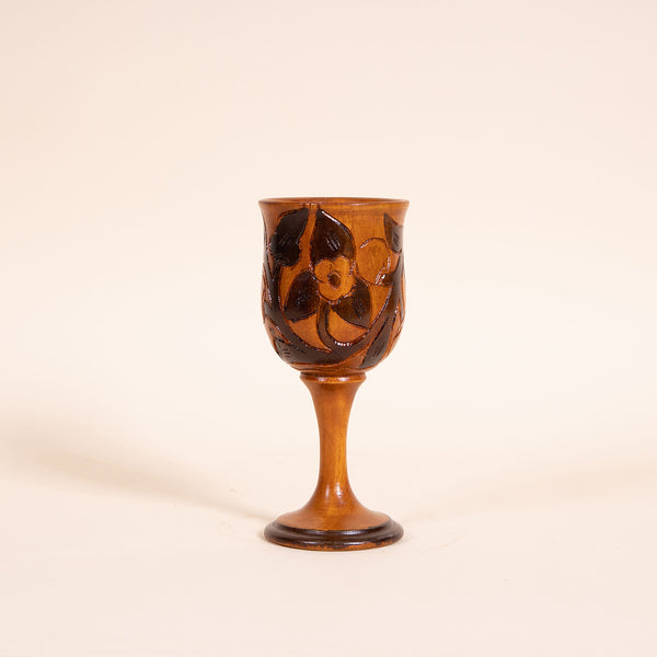 Contrasting hand-carved wooden wine goblet  Measures 3" diameter x 7.25" tall  Handwash only  *Note that due to the vintage status of wear - while we clean as thoroughly as we can, there may be some sun stains still existing.  Please examine the photos closely before making your purchase.  If you would like more information or have any other specific questions regarding the condition - email found@thehiddenhome.store*