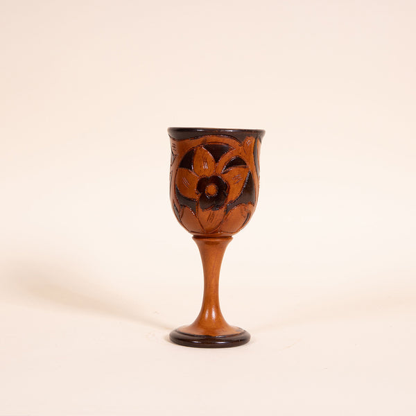Contrasting hand-carved wooden wine goblet  Measures 3" diameter x 7.25" tall  Handwash only  *Note that due to the vintage status of wear - while we clean as thoroughly as we can, there may be some sun stains still existing.  Please examine the photos closely before making your purchase.  If you would like more information or have any other specific questions regarding the condition - email found@thehiddenhome.store*