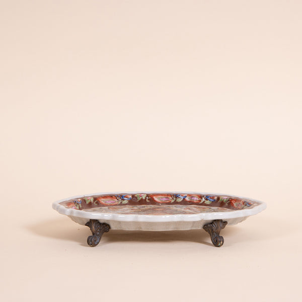Beautiful hand-painted oriental tray for holding jewelry and any other cute objects you have lying around.  Intricate floral illustration on top and mini claw feet giving it some flair.  For decorative purposes only!  NOT for food use  *Note that due to the vintage status of wear - while we clean as thoroughly as we can, there may be some dirt build up and stains still existing.  Please examine the photos closely before making your purchase.  If you would like more information or have any other specific que