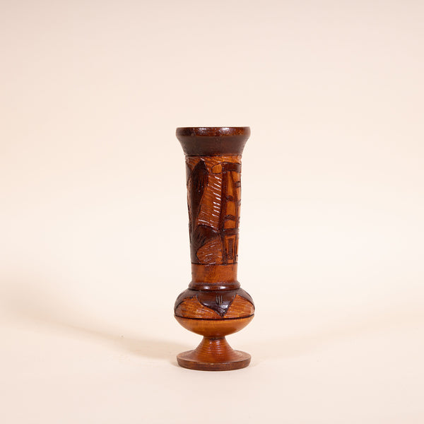 1970s Hand-carved wooden vessel, perfect for a tropical vintage feel in any room.  Measures 8.5" tall x 2.5" diameter  Features a Tiki Hut and flower  Spot clean only  *Note that due to the vintage status of wear - while we clean as thoroughly as we can, there may be some sun stains still existing.  Please examine the photos closely before making your purchase.  If you would like more information or have any other specific questions regarding the condition - email found@thehiddenhome.store*