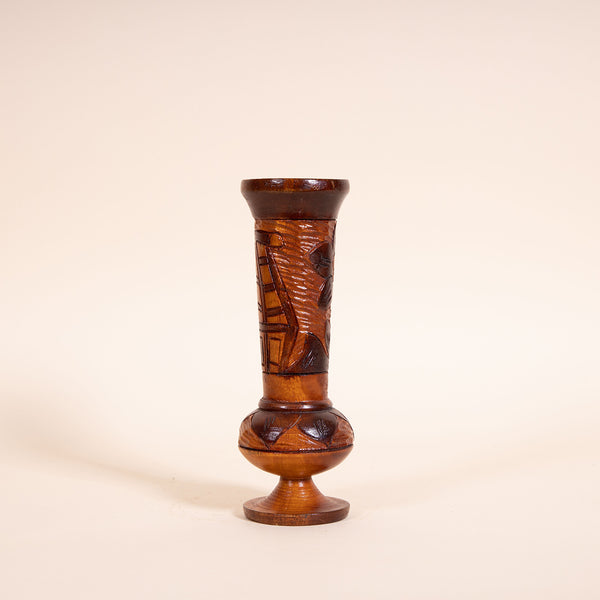 1970s Hand-carved wooden vessel, perfect for a tropical vintage feel in any room.  Measures 8.5" tall x 2.5" diameter  Features a Tiki Hut and flower  Spot clean only  *Note that due to the vintage status of wear - while we clean as thoroughly as we can, there may be some sun stains still existing.  Please examine the photos closely before making your purchase.  If you would like more information or have any other specific questions regarding the condition - email found@thehiddenhome.store*