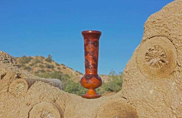 1970s Hand-carved wooden vessel, perfect for a tropical vintage feel in any room.  Measures 8.5" tall x 2.5" diameter  Features a Tiki Hut and flower  Spot clean only  *Note that due to the vintage status of wear - while we clean as thoroughly as we can, there may be some sun stains still existing.  Please examine the photos closely before making your purchase.  If you would like more information or have any other specific questions regarding the condition - email found@thehiddenhome.store*