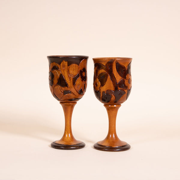 Contrasting hand-carved wooden wine goblet  Measures 3" diameter x 7.25" tall  Handwash only  *Note that due to the vintage status of wear - while we clean as thoroughly as we can, there may be some sun stains still existing.  Please examine the photos closely before making your purchase.  If you would like more information or have any other specific questions regarding the condition - email found@thehiddenhome.store*