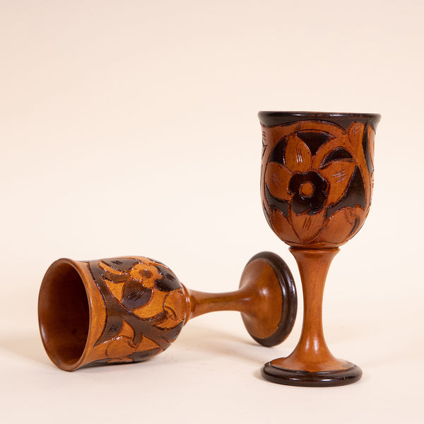 Contrasting hand-carved wooden wine goblet  Measures 3" diameter x 7.25" tall  Handwash only  *Note that due to the vintage status of wear - while we clean as thoroughly as we can, there may be some sun stains still existing.  Please examine the photos closely before making your purchase.  If you would like more information or have any other specific questions regarding the condition - email found@thehiddenhome.store*